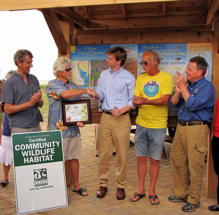 Bill McSpadden recognized by state and local officials at the Town Pavilion beside the Certified Community Wildlife Habitat sign