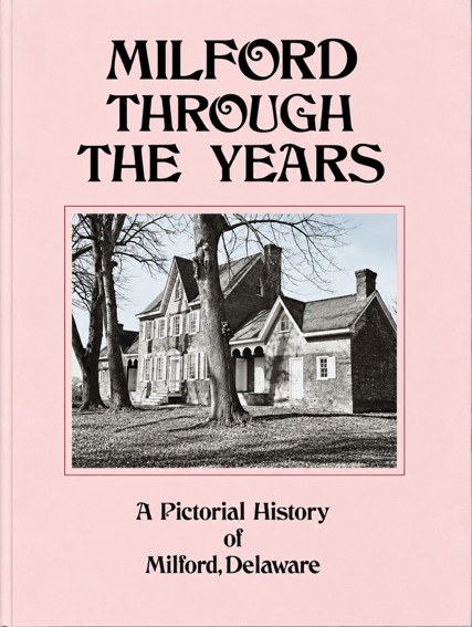 Cover of Milford Through the Years, A Pictorial History of Milford, Delaware, with a photograph of a brick house among bare trees
