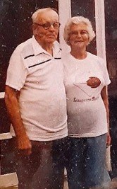 Willis Hammond and his wife Sybil standing together in front of a window